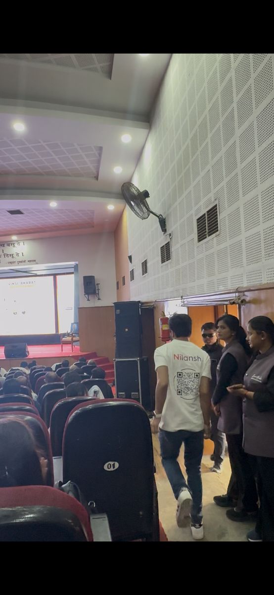 Nilansh walking toward the stage at RTMNU Nagpur for the Innopreneurs Season 12 pitch